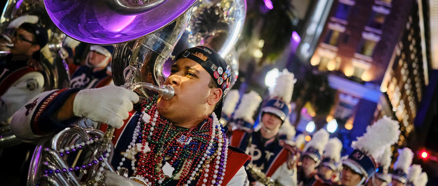 The Jaguar Marching Band marching with the Conde Cavaliers in downtown Mobile on Friday, Feb. 14, 2025.